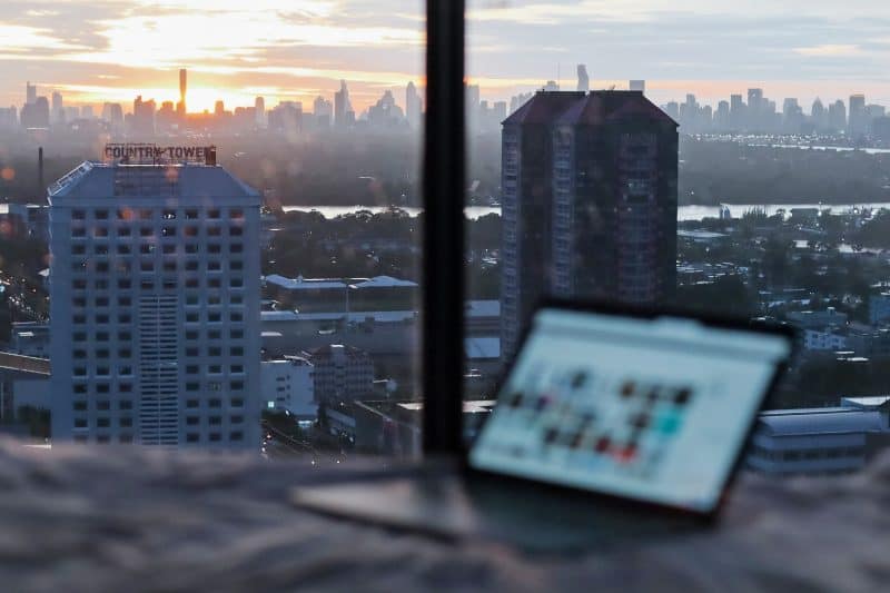 digital nomad laptop with city view